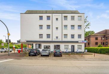 Voll vermietetes Mehrfamilienhaus mit Gewerbeeinheiten und Stellplätzen