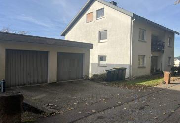 Attraktives 3-FH mit schönem Grundstück + Garagen in ruhiger Lage