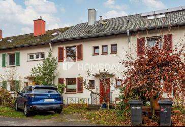 Charmantes Reihenhaus von 1954 mit Garten, Garage und moderner Dachsanierung auf Erbpachtgrundstück