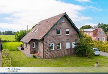 Modernes, vermietetes Einfamilienhaus mit großer Garage und traumhaftem Grundstück, Obj. 8866