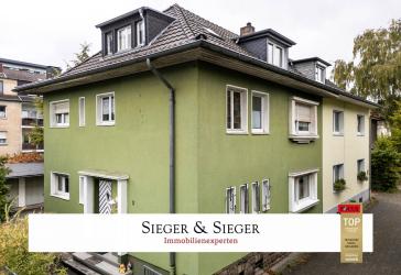 Kapitalanlage in Troisdorf: Dreiparteienhaus mit Garagen