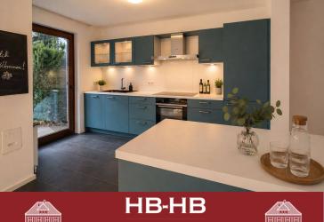Viel Raum zum Leben: renovierte Maisonette-Wohnung mit Garten und Garage in begehrter Lage
