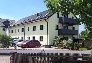 Mehrfamilienhaus mit 16 Wohnungen & 5 Bauplätzen für Doppelhaushälften – voll vermietet