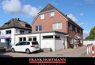 In zentraler Lage! Wohn-/ Geschäftshaus mit 5 Einheiten & 7 Garagen in Norderstedt