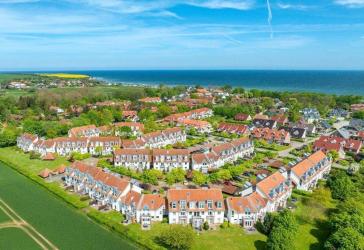 Doppelhaushälfte in der beliebten Ferienanlage „Sünnslag“ – Zentral & Strandnah!