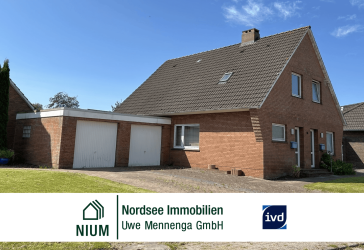 Zweifamilienhaus mit zwei separaten Wohnungen, Garagen, Keller und Garten in begehrter Wohnlage