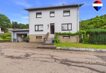 Familienhaus mit viel Platz, großer Garage und vielseitigen Nutzungsmöglichkeiten in Büschfeld