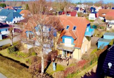 Helle Erdgeschosswohnung mit 2 Schlafzimmern, sonniger Terrasse und eigenem Garten.