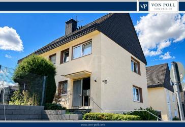 Vielseitiges Drei-Familienhaus mit sonnigem Garten und modernem Charme in beliebter Lage