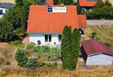 Naturidylle für die Familie: Lichtdurchflutetes Einfamilienhaus mit schönem Garten, Kamin & Terrasse