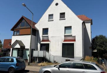 Mehrfamilienhaus mit Laden zum Kauf