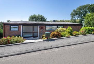Lichtdurchfluteter Bungalow-Traum mit paradiesischem Flair