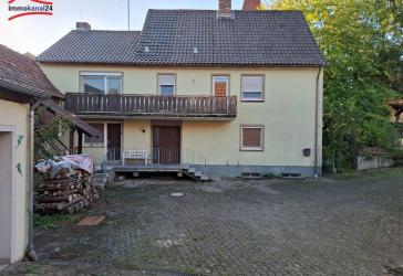 Vielseitiges Einfamilienhaus mit großem Garten und Nebengebäude in 97340 Martinsheim