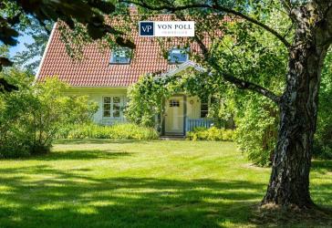 Skandinavienflair I Einladendes Einfamilienhaus mit Kamin, Wintergarten und großem Gartenidyll