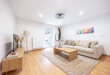 3-Zimmer-Erdgeschosswohnung mit überdachter Terrasse und eigenem Gartenanteil