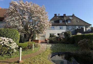 Vielseitige Doppelhaushälfte mit Einliegerwohnung, Ladenlokal & traumhaftem Garten