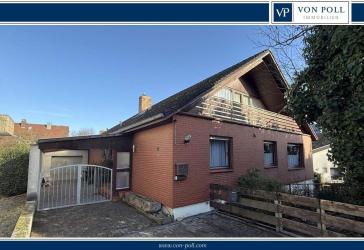 Wollmesheimer Höhe - Ruhig gelegenes Einfamilienhaus mit Klinkerfassade, kleinem Garten und Garage