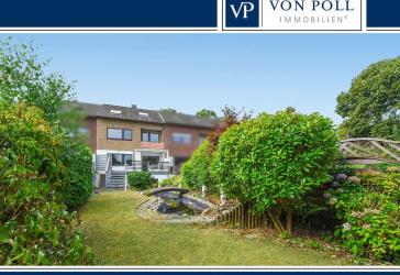 Lichtdurchflutetes Reihenmittelhaus mit modern gestalteter Hochterrasse, schönem Garten und Garage