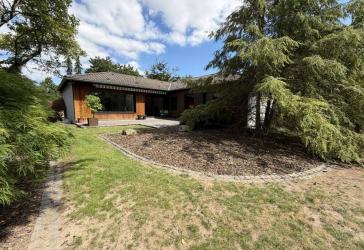 Seltene Gelegenheit in Ober-Olm: Großzügiger Winkelbungalow auf Traumgrundstück (957 m²)