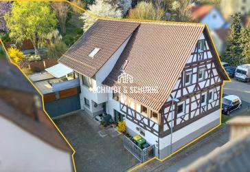 Zweifamilienhaus mit Garten und Vermietungspotenzial in ruhiger Lage
