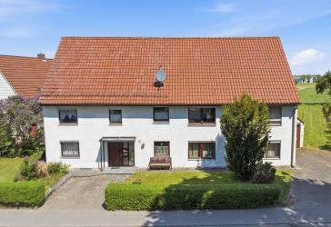 Blick ins Grüne! Charmantes Einfamilienhaus mit Ausbaupotenzial und sagenhaftem Grundstück