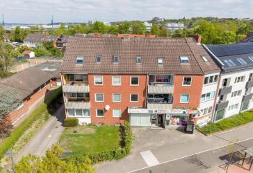 Wohn- & Geschäftshaus mit 19 Garagen und Stellplätzen