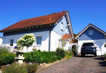 RESERVIERT: Attraktives Einfamilienhaus mit grüner Oase in ruhiger Lage