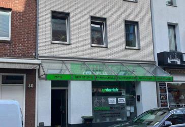 Mehrfamilienhaus mit Ladenlokal in zentraler Lage