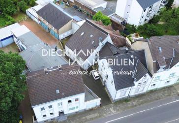 Kapitalanlage mit Entwicklungspotenzial - Mehrfamilienhaus mit 9 Wohneinheiten und 6 Garagen