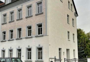 Mehrfamilienhaus mit Stellplätzen im Zentrum