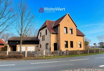 Platzwunder in Winsen: Zweifamilienhaus, 3 Garagen + Baugrundstück für ein Doppelhaus!