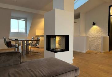 Bieterverfahren - Luxuriöse und gut vermietete Penthousewohnung im Münchner Süden
