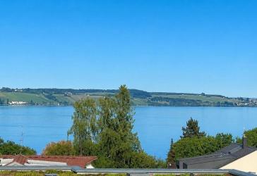 Sonnenbalkon mit See- und Alpenblick