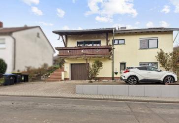 Exklusive Wohnimmobilie mit Einliegeroption, Garten und unverbaubarem Ausblick in Niddatal
