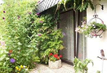Großzügiger Winkelbungalow (Satteldach, Fußbodenheizung, Garage)